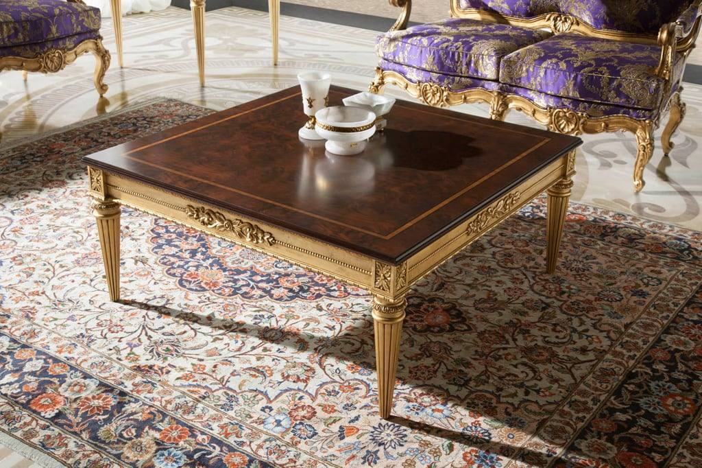 Gilded walnut table on a Persian carpet